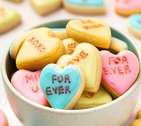 easy mini conversation heart cookies valentine s sugar cookie recipe, Iced mini conversation heart cookies with love messages displayed in a serving bowl