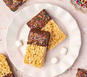 how to make chocolate dipped rice krispie treats, Close up of stacked chocolate dipped Rice Krispie treats with rainbow sprinkles showing crispy texture