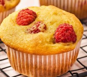 how to make chocolate dipped rice krispie treats, Fluffy muffins with a bite taken showing soft texture and raspberries