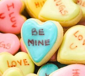 how to make chocolate dipped rice krispie treats, Pastel mini conversation heart cookies arranged on a white marble surface