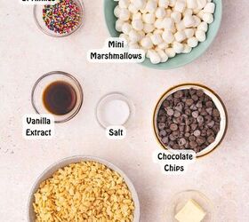 how to make chocolate dipped rice krispie treats, All ingredients for chocolate dipped Rice Krispie treats displayed on a table including Rice Krispies cereal mini marshmallows butter vanilla extract sea salt semi sweet chocolate chips and rainbow sprinkles