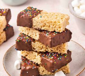 how to make chocolate dipped rice krispie treats, A neat stack of chocolate dipped Rice Krispie treats topped with rainbow sprinkles on a white plate