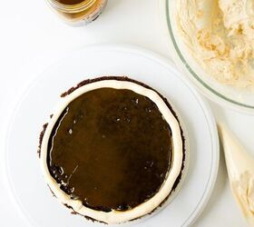 chocolate caramel cake recipe rich moist easy, Caramel filling spread evenly inside a buttercream border on a chocolate cake layer