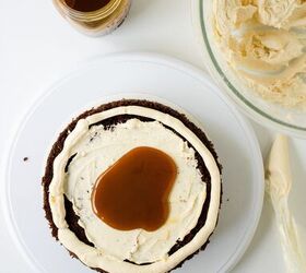 chocolate caramel cake recipe rich moist easy, Buttercream frosting added on top of caramel filling before stacking the cake layers