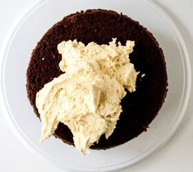 chocolate caramel cake recipe rich moist easy, Buttercream frosting spread over a chocolate cake layer to seal the caramel filling