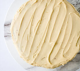 chocolate caramel cake recipe rich moist easy, Fully frosted chocolate caramel cake with smooth buttercream finish on a cake stand