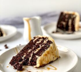 chocolate caramel cake recipe rich moist easy, Side view of a chocolate caramel cake slice on a white plate with caramel sauce dripping over frosting