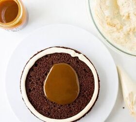 chocolate caramel cake recipe rich moist easy, Caramel sauce spooned into the center of a buttercream ring on a chocolate cake layer