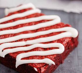 red velvet brownies, Close Up of Red Velvet Brownie Cut into a Square and Drizzled with Frosting