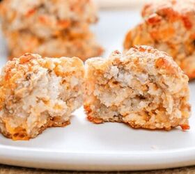 cheddar bay sausage balls, a cheddar bay biscuit sausage balls cut in half on a white plate