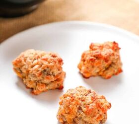 cheddar bay sausage balls, 3 red lobster cheddar bay biscuit sausage balls on a plate