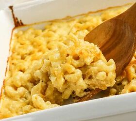 3 cheese macaroni and cheese recipe for pure comfort, Spoon lifting a serving of gooey three cheese macaroni and cheese from a baking dish