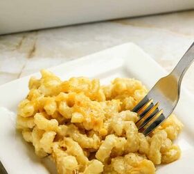 3 cheese macaroni and cheese recipe for pure comfort, Fork digging into a creamy serving of three cheese macaroni and cheese on a plate
