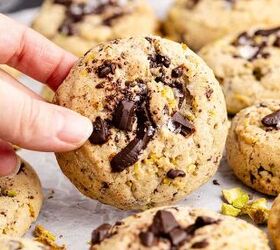 pistachio chocolate chip cookies, Pistachio Chocolate Chip Cookies on parchment paper being picked up