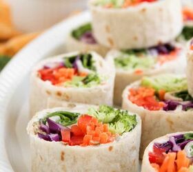 rainbow veggie pinwheels recipe easy and colorful, Close up of sliced vegetable pinwheel wraps on a serving plate