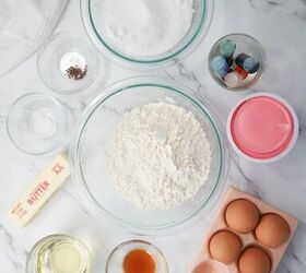easter bundt cake recipe for spring celebrations, Ingredients for Easter bundt cake including softened butter flour eggs and oil in glass bowls on a marble surface