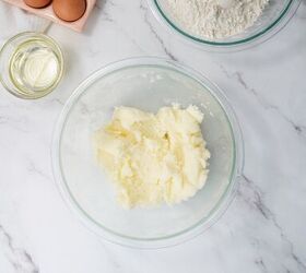 easter bundt cake recipe for spring celebrations, Ingredients for Easter bundt cake including eggs flour oil and softened butter on a marble countertop