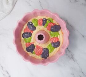 easter bundt cake recipe for spring celebrations, Colored cake batter spooned into a pink bundt pan for a marbled Easter cake
