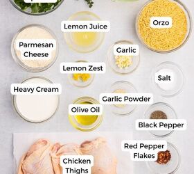creamy chicken orzo bake one pan dinner, Ingredients for a chicken orzo bake arranged on a countertop including spinach thyme chicken broth orzo Parmesan cheese lemon juice and zest garlic salt heavy cream olive oil spices chicken thighs and red pepper flakes