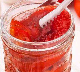 the best beef and barley stew comforting one pot recipe, Using tongs to lift a roasted red bell pepper from a glass jar showing tender flesh