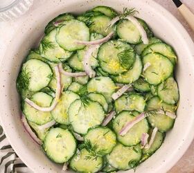 creamy cucumber dill salad easy salad with yogurt dressing, Overhead view of cucumber dill salad on rustic plate with fresh dill garnish
