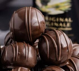 crockpot easter candy clusters, Baileys Truffles on a plate with a bottle of baileys in the back up close