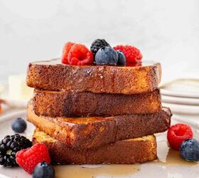 air fryer french toast easy ready in minutes, A stack of French toast slices topped with fresh raspberries blueberries and blackberries drizzled with syrup served on a white plate