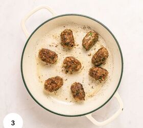 greek beef meatballs in tomato sauce soutzoukakia, A white pot with eight browned Greek Beef Meatballs arranged in a circle on a light colored surface The number 3 is in a white circle in the bottom left corner