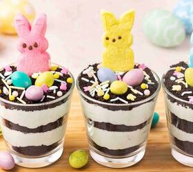 easy easter pistachio pudding dirt cups with oreos and peeps, Glass cups filled with pistachio pudding and cookie crumbs topped with Easter themed decorations