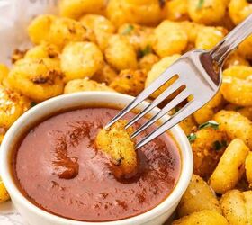 crispy air fryer gnocchi recipe easy snack ready in minutes, Air fryer gnocchi arranged on a platter with a bowl of marinara sauce ready to dip and enjoy