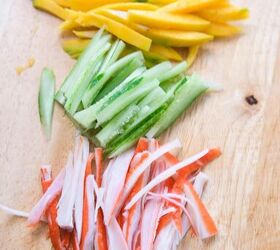 quick and easy spicy crab salad in just 15 minutes, Julienned mango cucumber and imitation crab neatly sliced and arranged on a cutting board