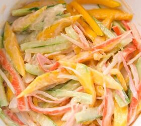 quick and easy spicy crab salad in just 15 minutes, Spicy crab salad fully mixed with mango and cucumber in a white bowl
