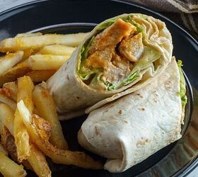 buffalo chicken wrap recipe healthy buffalo chicken wrap, Two pieces of a buffalo chicken wrap on a low carb tortilla