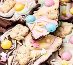 easy 4 ingredient peeps s mores dip for easter, Pastel Easter Chocolate Bark on a platter with a bite taken from one piece showing the marbled chocolate and candy layers inside
