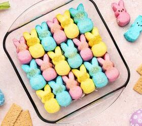 easy 4 ingredient peeps s mores dip for easter, Chocolate s mores dip topped with colorful Easter Peeps ready to scoop with graham crackers