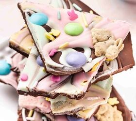 pastel easter chocolate bark the best candy treat for easter, Side angle close up of Pastel Easter Chocolate Bark pieces stacked slightly showing thickness colorful swirls and candy toppings