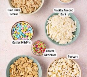 easy easter bunny bait snack mix no bake recipe, All ingredients for Easter Bunny Bait laid out on a countertop including Chex cereal popped popcorn Bunny Grahams M Ms white candy melts Easter sprinkles and shredded coconut