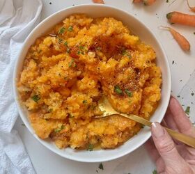 garlic brown butter mashed carrots and rutabaga, Garlic brown butter drizzled over a warm bowl of mashed rutabaga and carrots garnished with fresh parsley