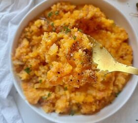 garlic brown butter mashed carrots and rutabaga, Close up of rustic mashed carrots and rutabaga with visible browned butter and flecks of fresh parsley