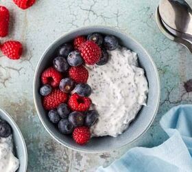 easy high protein greek yogurt bowl with chia seeds berries, Overhead shot of a high protein Greek Yogurt bowl Creamy Greek yogurt mixed with chia seeds and topped with fresh blueberries and raspberries Fresh raspberries are scattered around the scene