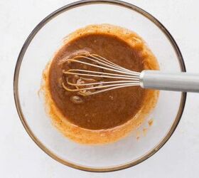 chewy chocolate chip protein cookies gluten free refined sugar free, Tahini almond butter maple syrup egg and vanilla being whisked together for chocolate chip protein cookies