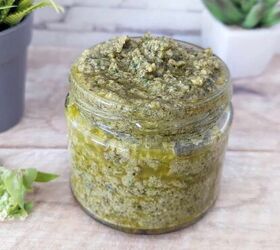black garlic vegan pesto, A jar of vegan black garlic pesto with ornaments faded in the background