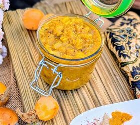 black garlic vegan pesto, Jar of homemade n spero loquat chutney with fresh loquats and Indian spices on a rustic wooden board
