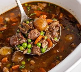 lamb stew crock pot, Crock Pot Lamb Stew in a ladle over a slow cooker