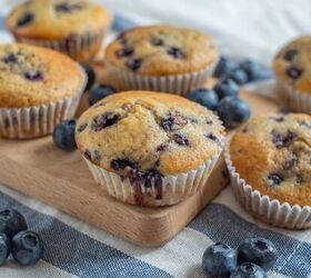 cottage cheese muffins cottage cheese blueberry muffin recipe, Close up image of cottage cheese muffins on a cutting board with blueberries scattered