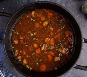 pork prime rib, Guinness Lamb Stew from above in a Dutch oven cooked with bread and bowls beside