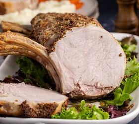 pork prime rib, Pork Prime Rib cooked on a platter with a slice facing forward