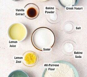 best lemon poppy seed muffins with sliced almonds, Ingredients for lemon poppy seed muffins on a table flour sugar eggs Greek yogurt lemon poppy seeds vegetable oil and sliced almonds