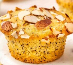 easy carrot cake muffins with cheesecake filling no frosting needed, Freshly baked lemon poppy seed muffins with almond topping arranged on a serving plate