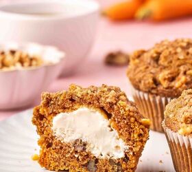 easy carrot cake muffins with cheesecake filling no frosting needed, Bakery style carrot cake muffin with domed top cut to reveal creamy cheesecake filling in the middle